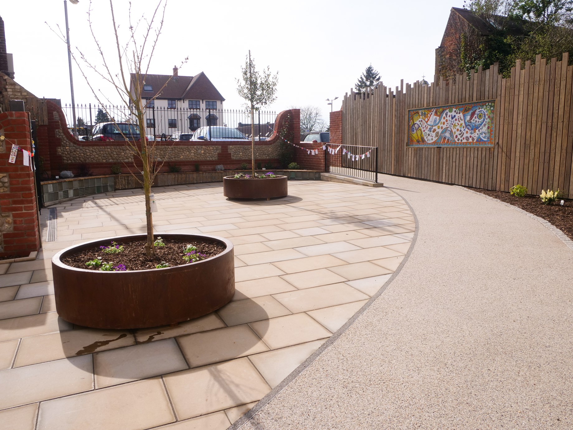 Black Swan Loke - featuring the mosaic, tree planters and newly paved area.