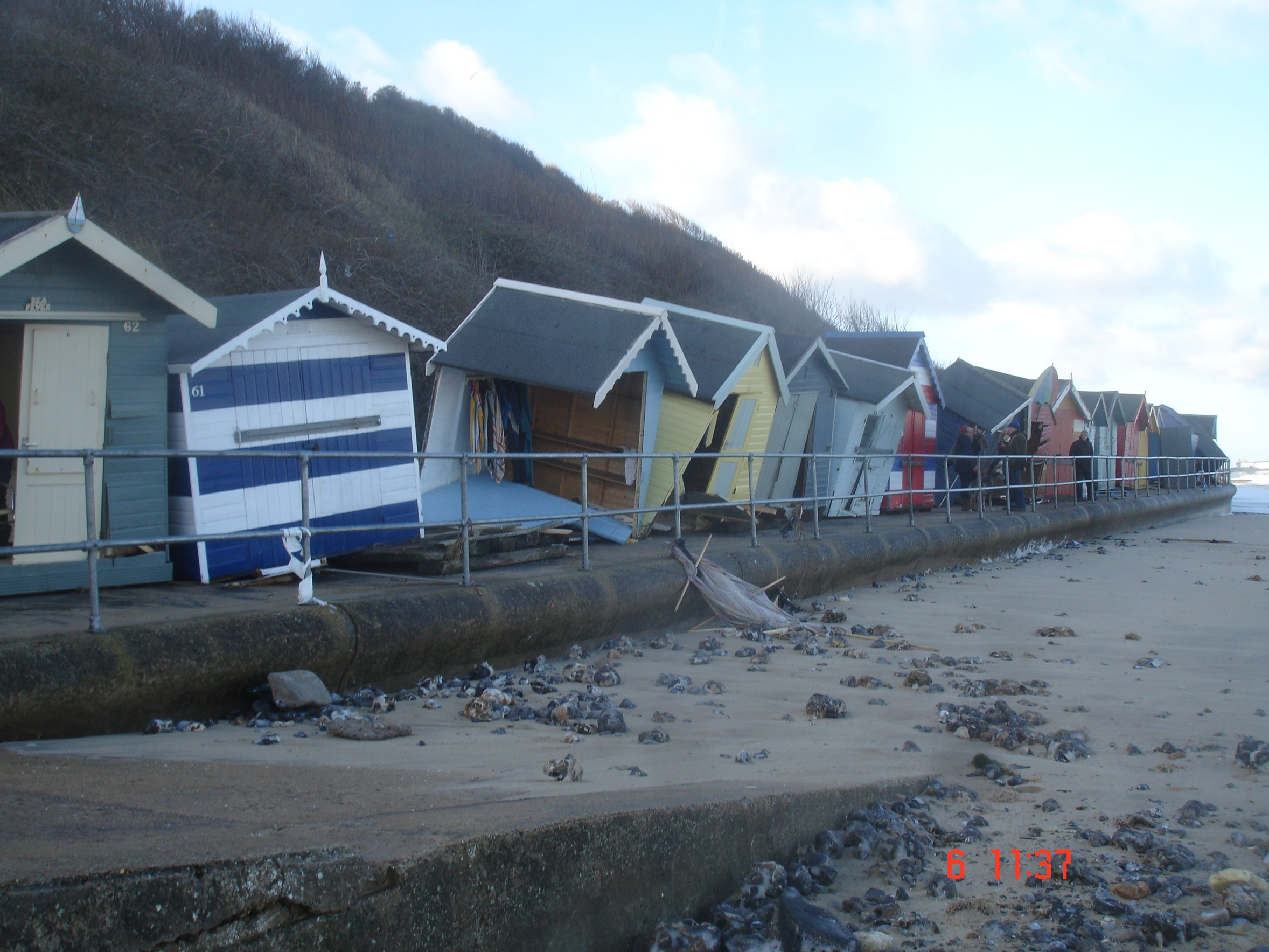 Damaged beach huts during 2013 storm surge