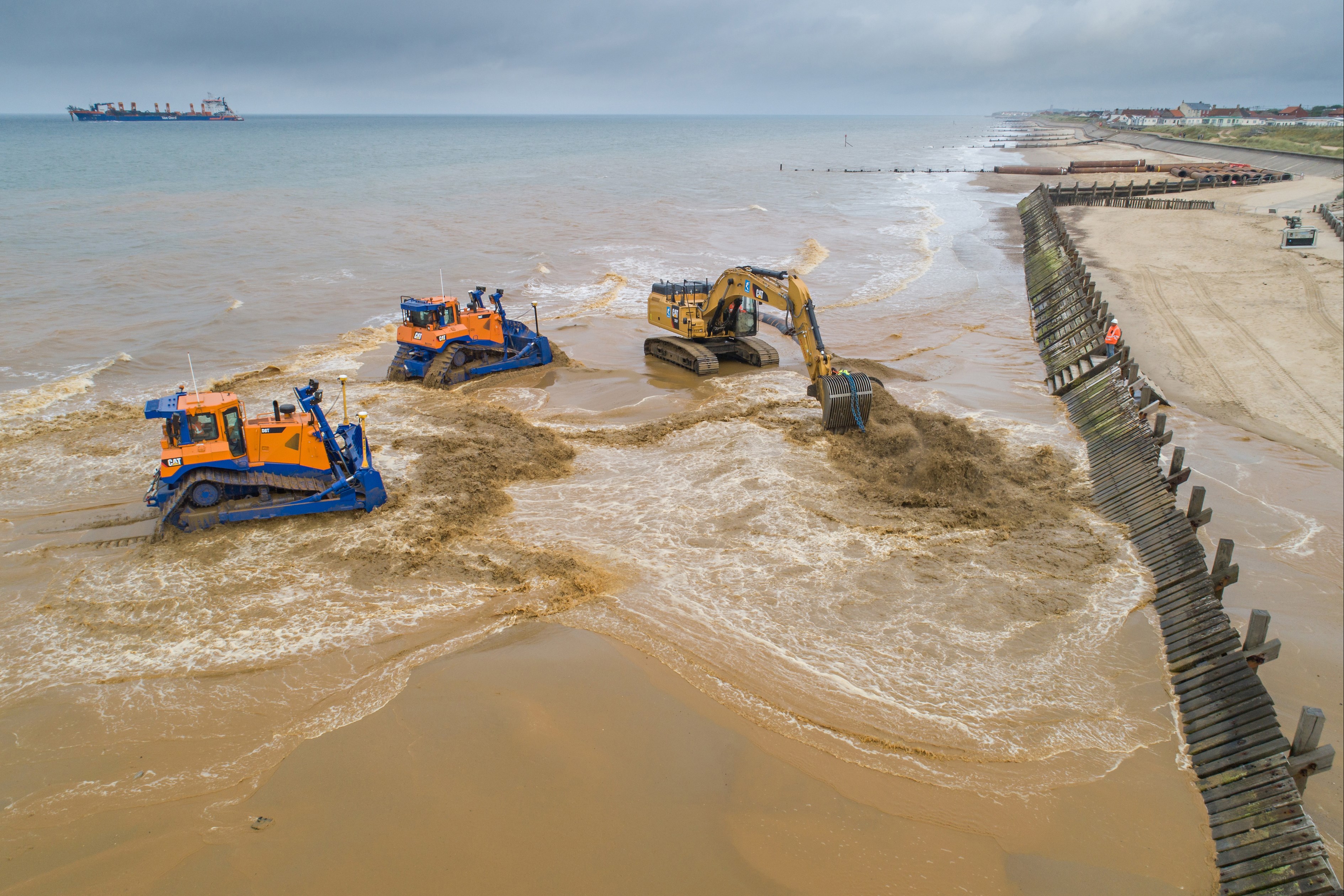 Diggers on beach at Sandscaping Scheme