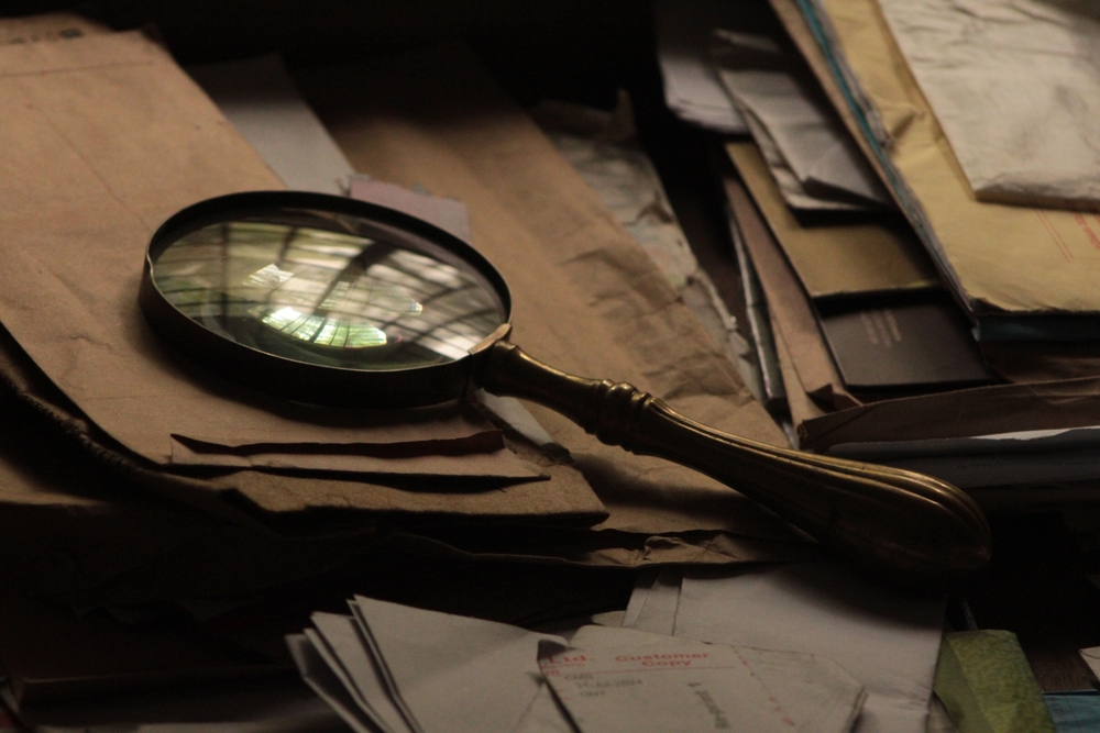 stock photo old magnifying glass secret documents