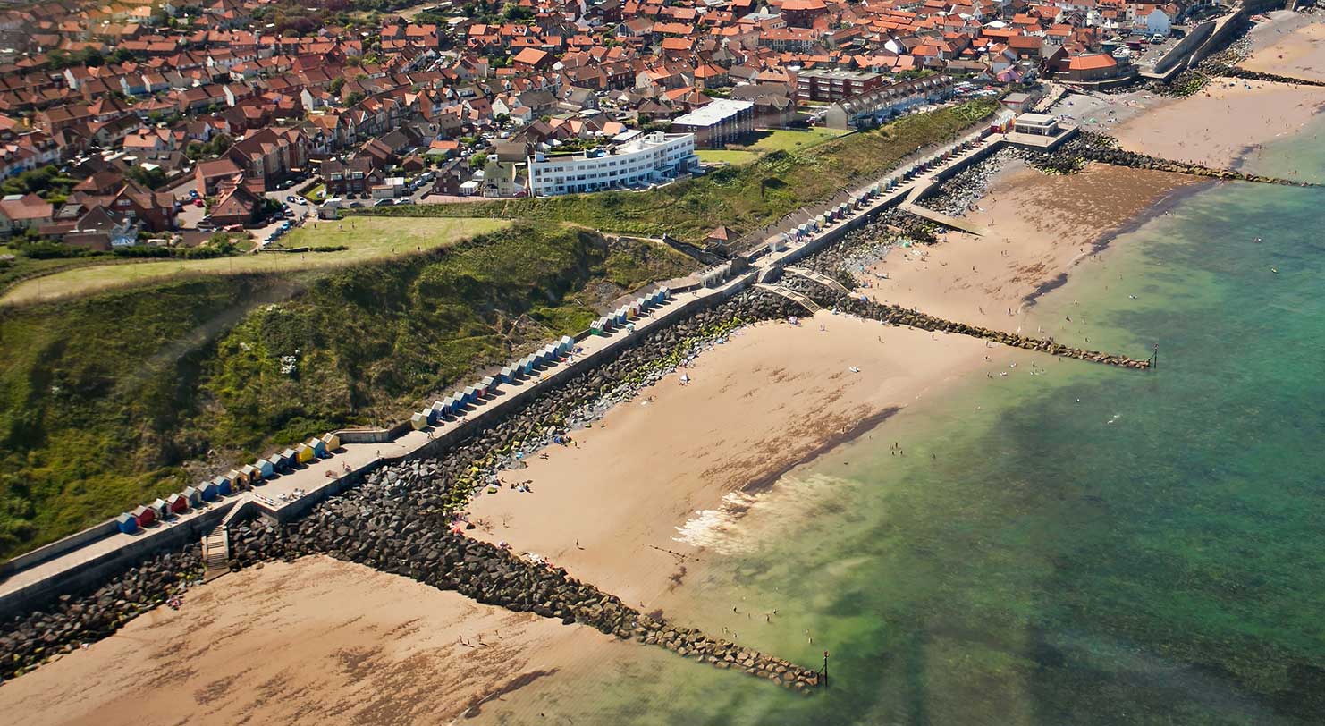 Arial shot of beach huts on Sheringham beach