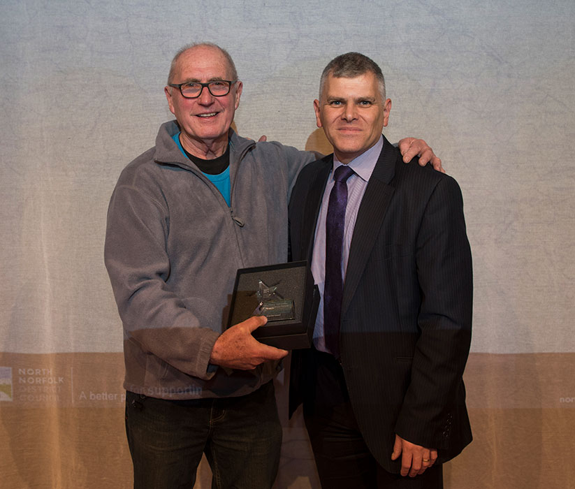 Head of Paid Service Steve Blatch presents to Colin Seal Sheringham artist