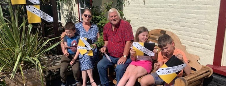 Clive Stockon and family with Norfolk Day flag.jpg