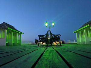 Cromer Pier lights up green for St John's Day