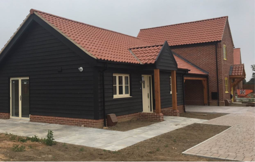 image of a black and brown house