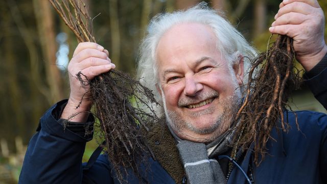 Image Cllr. Nigel Lloyd at one of the Tree Giveaways. Photo credit: Denise Bradley, EDP