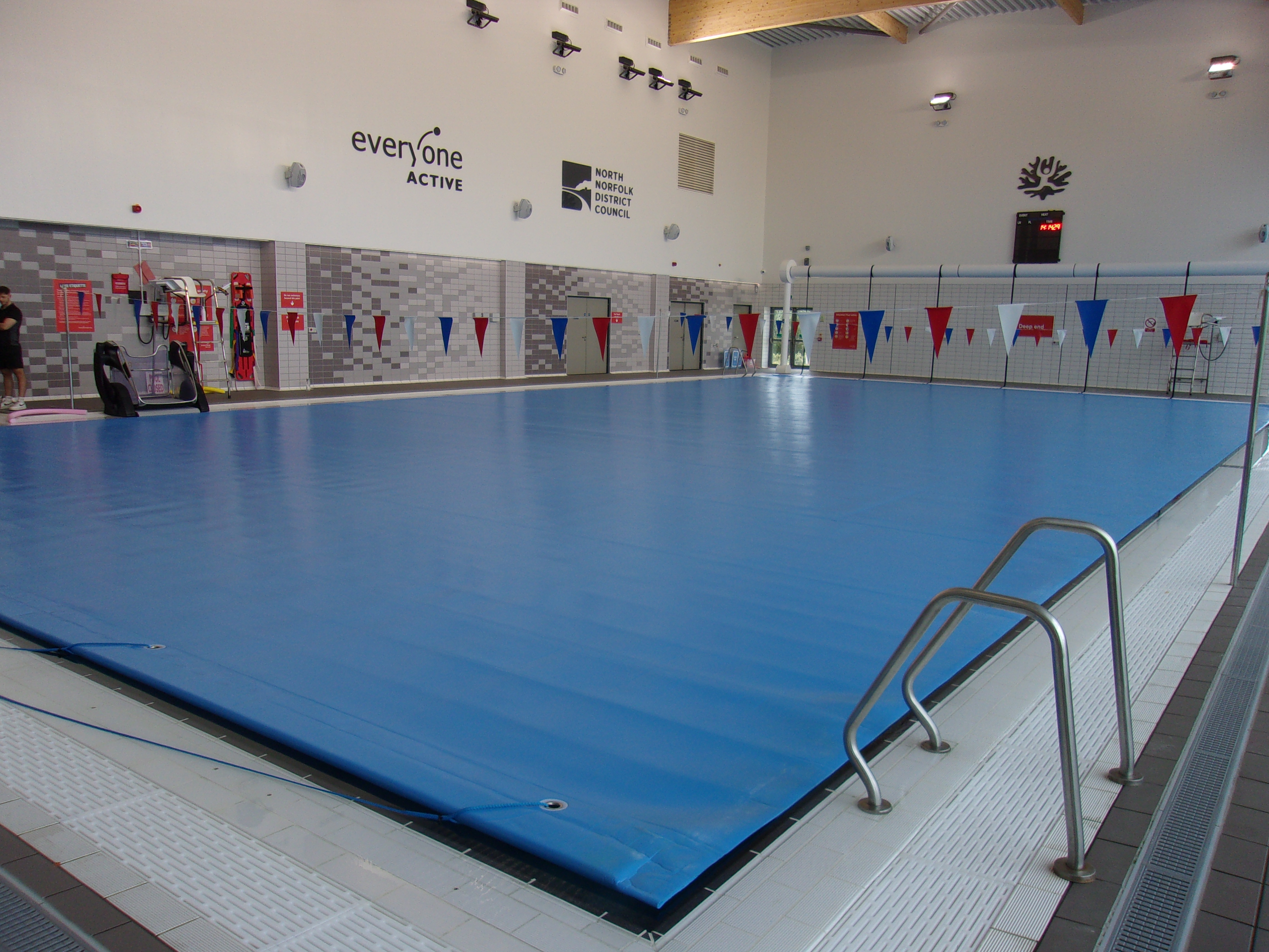 image of large blue pool cover over the Reef Leisure Centre swimming pool